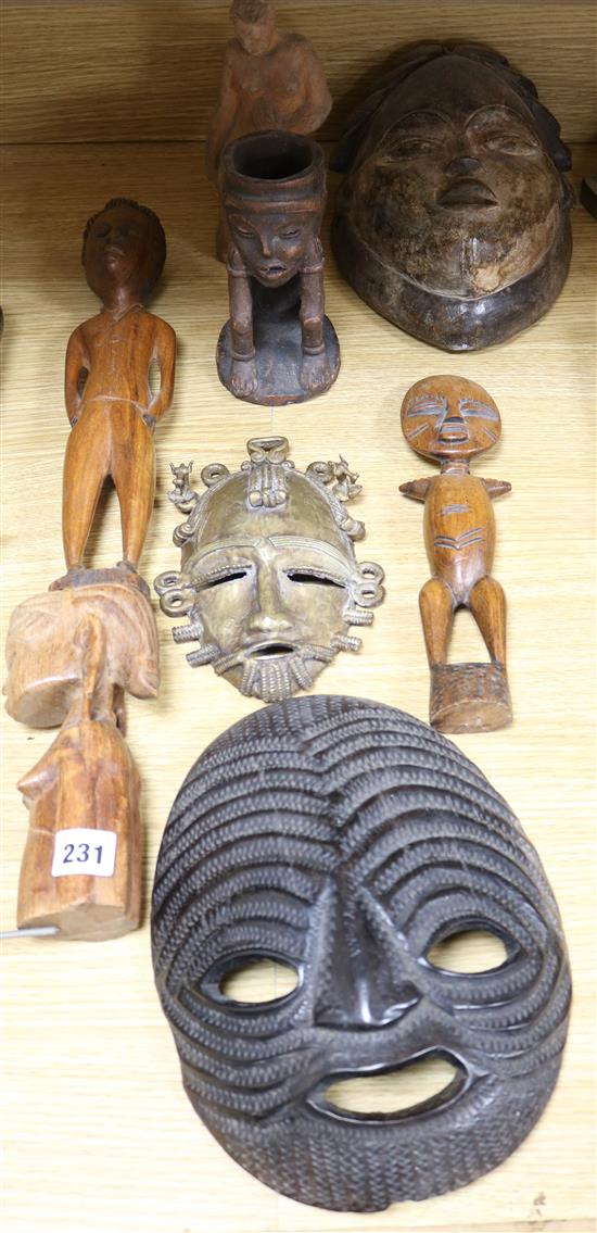A collection of tribal masks and sculpture